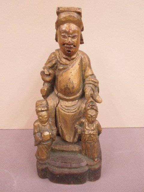 Chinese Wood Carving-10 Judges of Hell (1): Chinese wood carving of one of the ten judges of hell; seated on throne with two young servants; 18th C., height 10 1/8". CONDITION: Over painted, wood splits, losses to hands, missing hair insets.