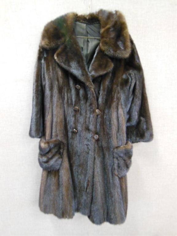 Lady's Stroller Length Mink Coat: Lady's stroller length mink coat, double breasted plastic buttons with amber colored rhinestones, (some missing), patch pockets, 16" across shoulders, 39" length. CONDITION: Good, some rhinestones mis