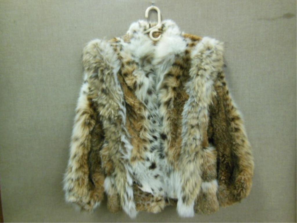 Lady's Lynx Jacket: Lady's Lynx jacket, Tarnopol's, Phila. "V" trim design on front and back, hook and eye closures, 18" across shoulders, 29" length, monogrammed. CONDITION: Very fine.