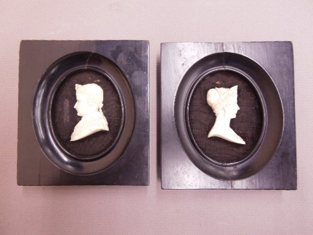 Pair of Ivory 2 Dimensional Silhouette Bust: Pair of Ivory 2 dimensional silhouette bust carvings, of Napoleon & Josephine, in ebonized wood frames, 19th C., ivory 2" x 1 1/4"; frame 4 1/4" x 4 3/4". CONDITION: Both wood frames cracked, 1 with s