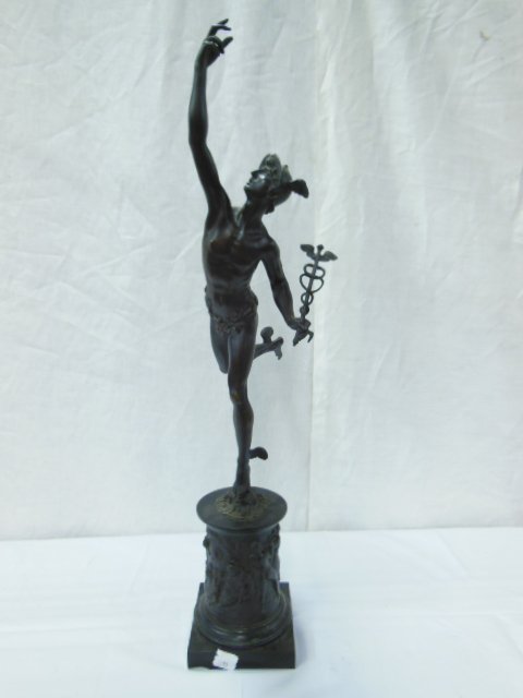 Bronze Sculpture of Mercury: Bronze sculpture of Mercury, he stands upon North Wind mask and black slate and bronze allegorical relief cast base, 19th C., height 32". CONDITION: No issues identified.