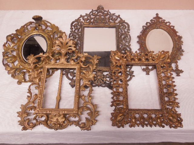 (5) Victorian, Baroque & Rococo Table Picture Frames: (5) Victorian, Baroque & Rococo table picture frames, The round rococo is brass, 4 of the others are brass plated, one is gold painted, 3 have mirrors; 3 free standing - 2 hanging, late 19th to early 