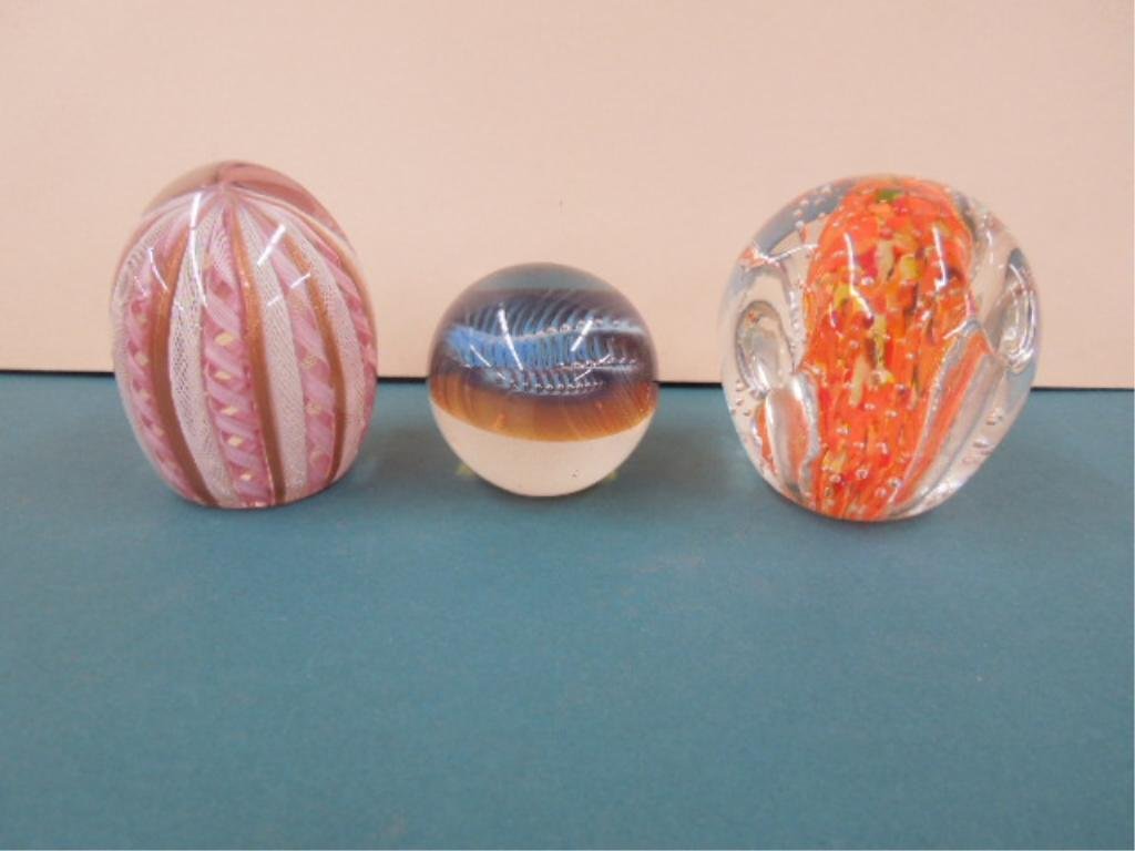 (3) Glass Paperweights: (3) glass paperweights; unsigned, 3 3/4"h latticcino; 2 1/2"d opalescent ribbed & bubbles, 3 1/2"h clear, orange & yellow glass with 4 pen holder slats, late 20th C. CONDITION: No issues noted.