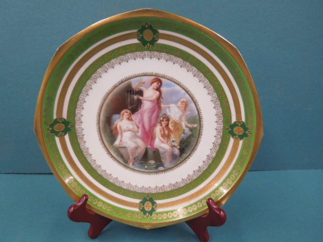 Austrian Porcelain Portrait Plate: Circa 1884-1909 Moritz Zdekauer Austrian porcelain 9 3/4" portrait plate, center with transfer and hand painted scene with 4 maidens, hand painted gilt floral & scroll borders. CONDITION:
