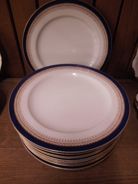 Set of 12 Royal Worcester Service Plates: Set of 12 Royal Worcester Service Plates, gilt, blue & beige borders; 10" diameter, early 20th c. CONDITION: Areas of gold highlight losses.