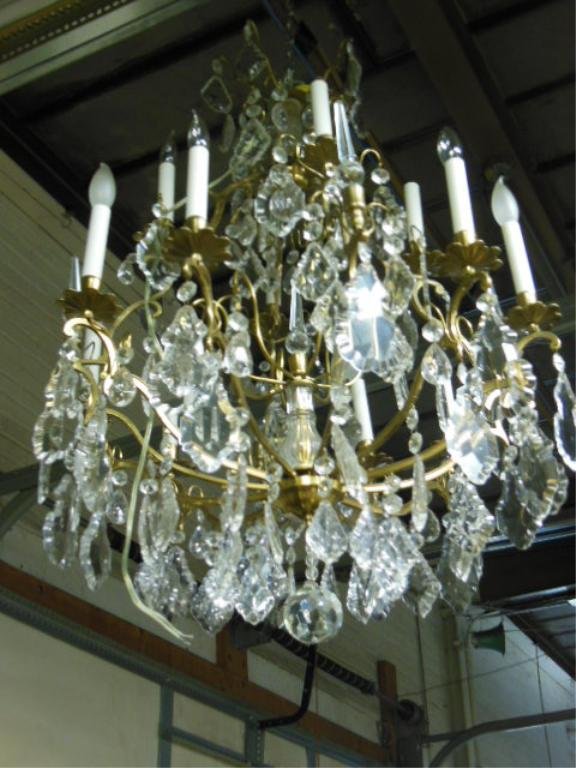 Crystal & Brass Chandelier: Crystal & Brass Chandelier, 16 light features crystal rods, spears, shaped prisms & cut crystal center ball pendant, mid 20th C. D30"; H38". CONDITION: No issues noted.