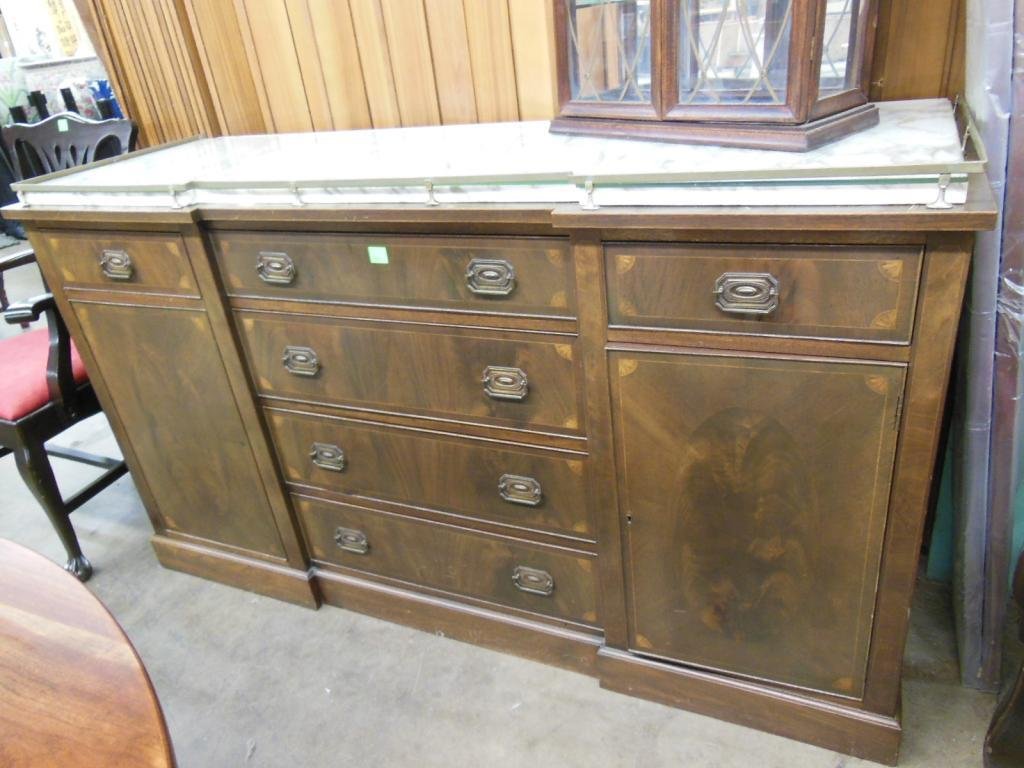 Sheraton-style mahogany inlaid sideboard: Sheraton-style mahogany inlaid sideboard with brown-veined white marble top, single drawer-over-door flanking four-drawer center case, 20th c. 65 1/2"=L; 38 1/4"=H; 22 1/2"=d. CONDITION: Minor and spo