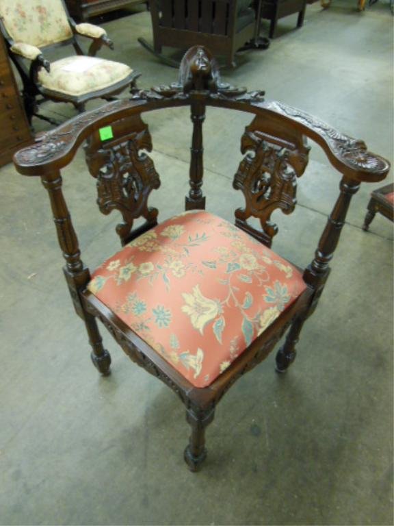 Stylized Corner Chair: Stylized corner chair, mahogany with mask, shell and sea horse carvings, slip seat, late 20th C. CONDITION: No issues identified.