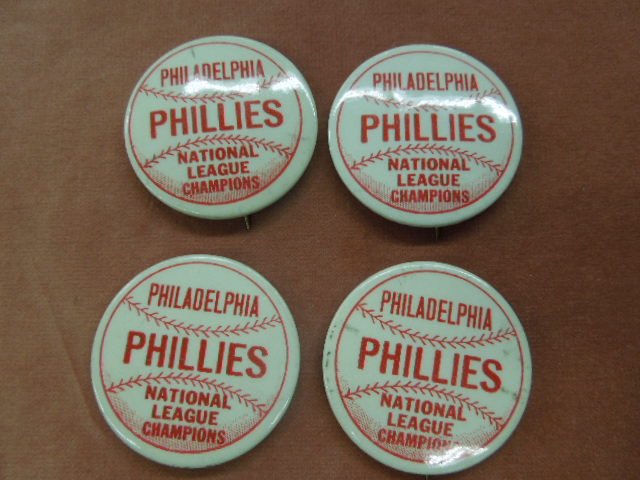 (4) Philadelphia Phillies National League Pin: (4) Philadelphia Phillies National League Champions pin backs. CONDITION: 2 With abrasions.