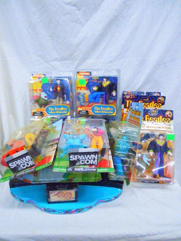 Lot of 11 Beatles Figures & Stage By Mc Farlane: Lot of 11 Beatles Figures & Stage By Mc Farlane Toys. from 1999 & 2004. Condition: Figures are new in original packaging, stage is loose. Packages show wear and bending on backing cards.
