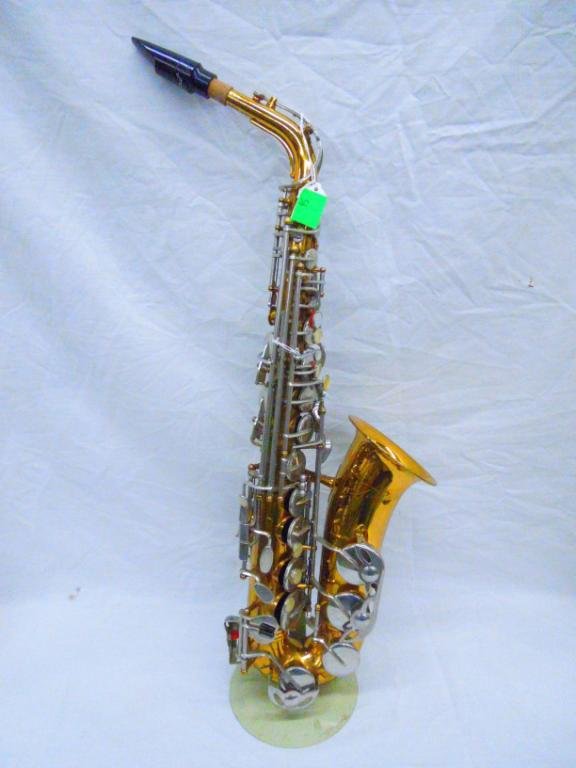 Armstrong Alto Saxophone SER# 4006097: Armstrong Alto Saxophone SER# 4006097 with case. Condition: Shows significant finish wear and scratching.