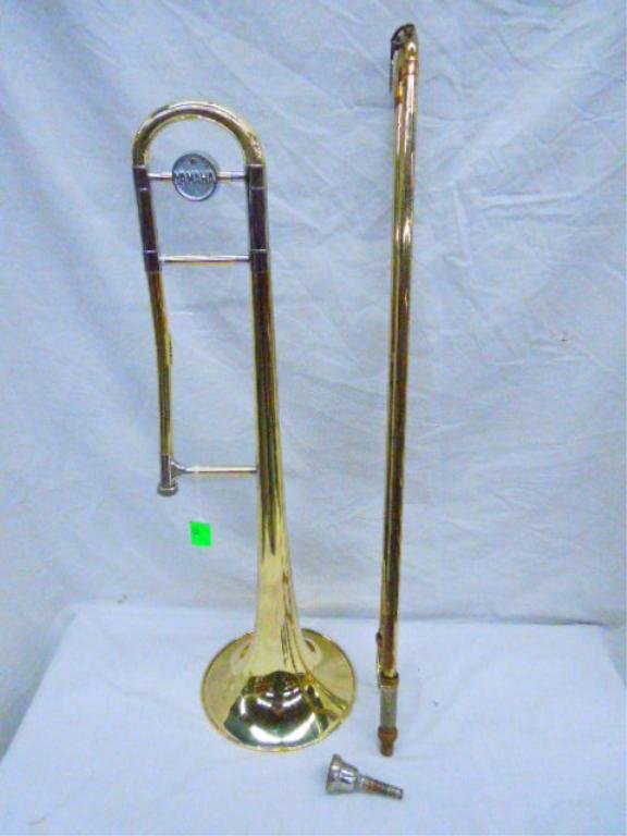 Yamaha Brass Trombone With Case: Yamaha Brass Trombone With Case. No SER# or model noted. Condition: Fair, has finish loss, some dents.