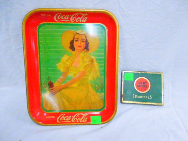 Tin Coca Cola Tray & Cigarette Box: Tin Coca Cola tray & Lucky Strike cigarette box. CONDITION: Some roughness to box & tray, fair to good from age.