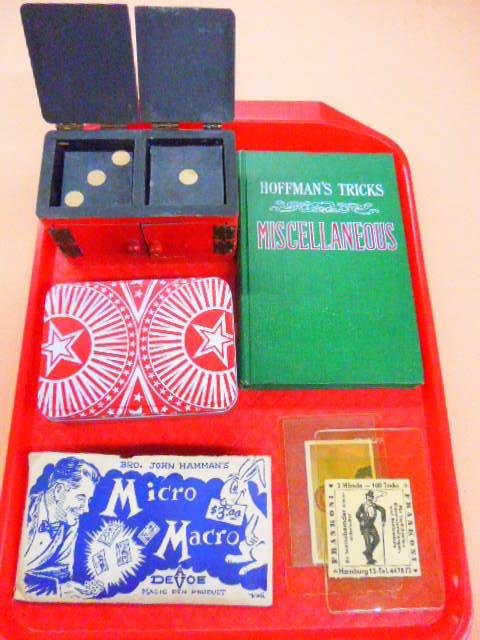 Lot of Magic Items: Lot of magic items including: German business card Frankoni - 2 hands - 100 tricks, #42 German trading card (Een Luifersdoosje Laten Rammelen) tin box with dice & playing cards, Bro. John Hamman's mic