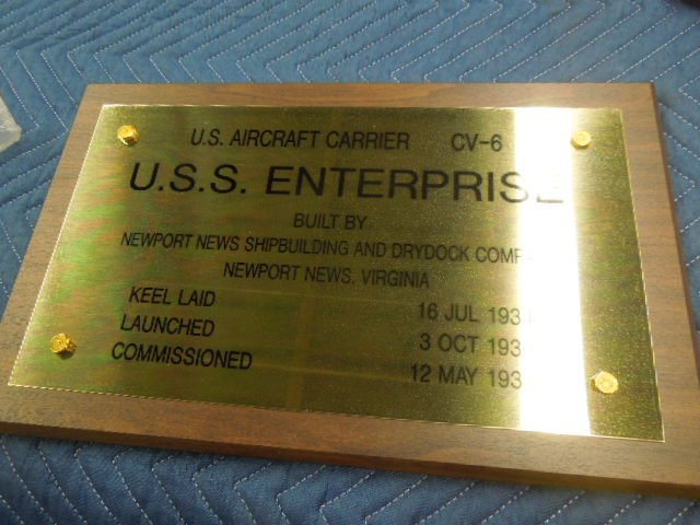 U.S. Enterprise Aircraft Carrier Plaque: 10" x 16" brass on wood base, built Newport News shipbuilders, launched Oct. 3, 1936, commissioned May 12, 1938 Condition; new out of box, still in factory plastic