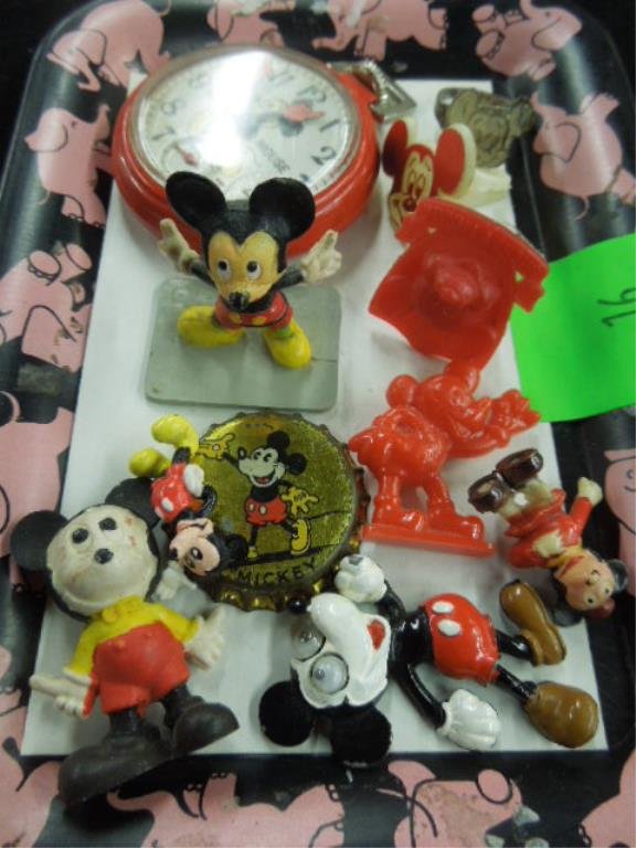 1 Lot Mickey Mouse Collectibles: Including: Pocket watch, rubber and plastic figures, metal googly eyed figure, 2 plastic and 1 tin ring and 1 bottle cap. Condition: Wear from age, working condition of watch unknown.