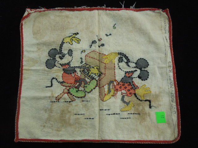 1930's Mickey Mouse Pillow Cover: No. 97 Mickey Mouse series, copy right 1931, painted and embroidered, featuring Mickey playing the piano and Minnie dancing 15" x 17" Condition; staining and wear from age, open end has fraying