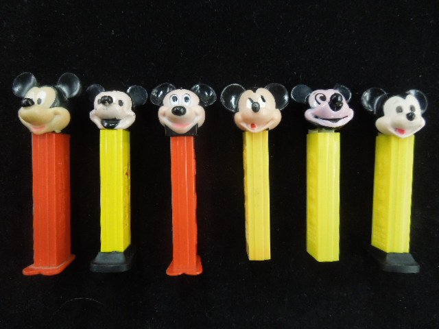 6 Mickey Mouse PEZ Dispensers: Including: 2 with removeable feet, Vintage PEZ with cut out Minnie on side. Condition: Minor wear especially on older dispensers. Numbers include: 3.942683 made in Hong Kong, 3.410455 made in Austria,