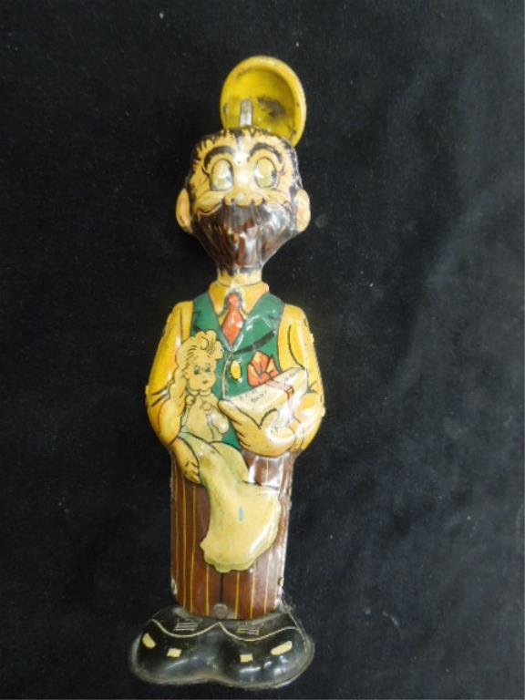 Vintage Marx Mountain Man: tin wind up "B.O. Plenty, with movable hat and waddle action 8 1/2" h Condition; wear and scratches from age, working