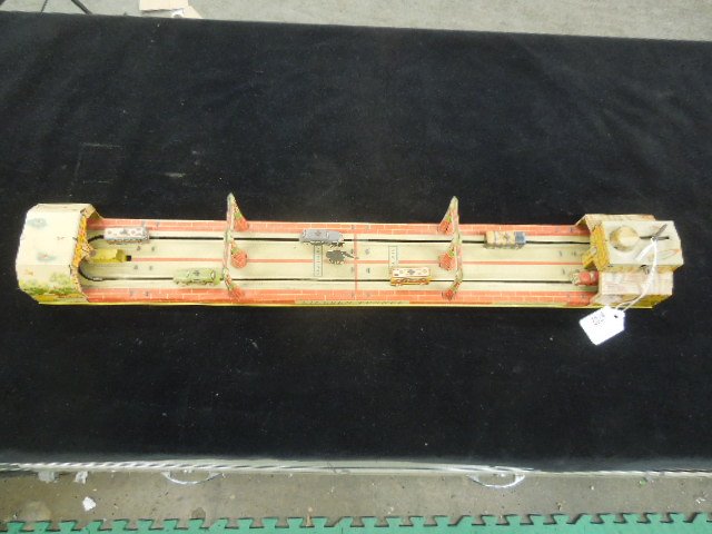 Vintage Lincoln Tunnel Playset: tin wind up, Unique Art Mfg., with 6 movable cars, 24" l x 3" h, Condition; minor wear from age not working