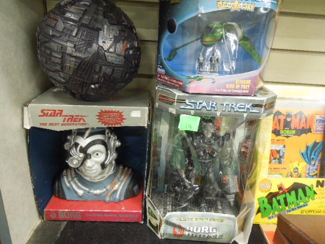 4 Star Trek Collectibles: including Borg Sphere, Borg Savings Bank, Klingon Bird of Prey and Alien Combat series Borg Drone, all imn original pakaging; Condition; packaging much wear to some wear, sphere not in package, minor 