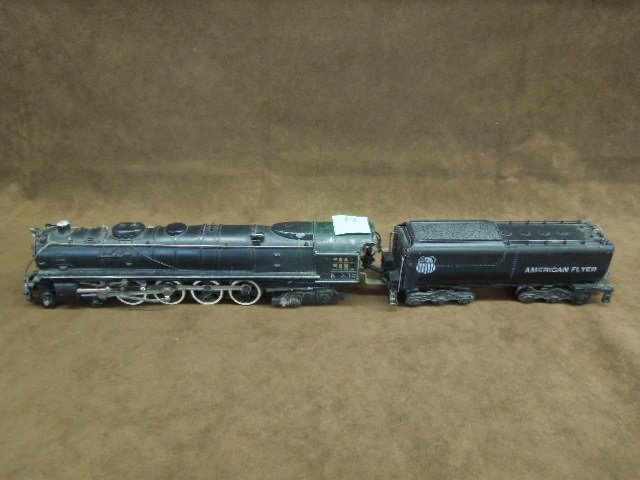 American Flyer Engine & Tender: American Flyer engine & tender, engine #K335, smokes & lights. CONDITION: Fair, showing paint loss & wear from age.