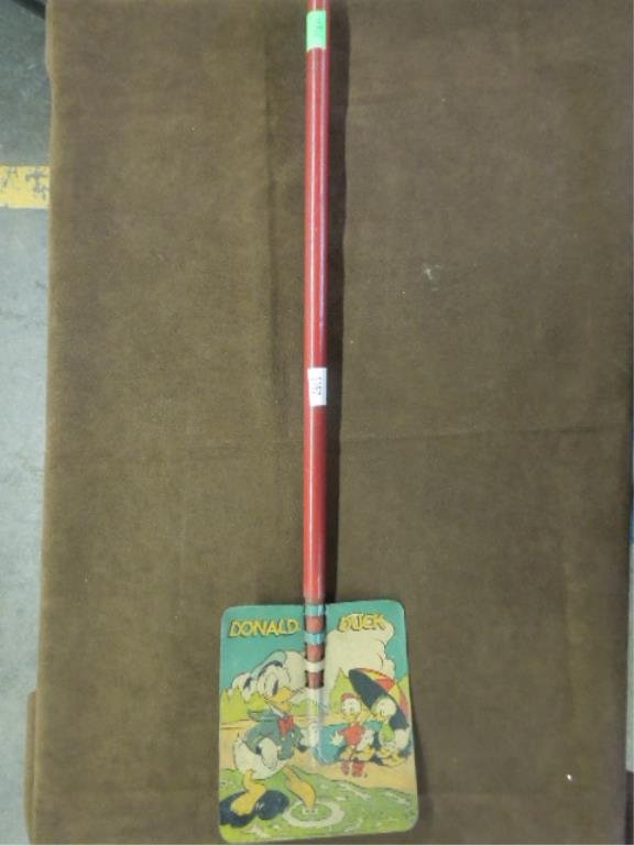 Donald Duck Sand Shovel: Donald Duck sand shovel, 1939 Walt Disney Productions (WDP), Ohio Art Co. wood handle. CONDITION: Wear & scratches to shovel back, some wear to face & wood handle.