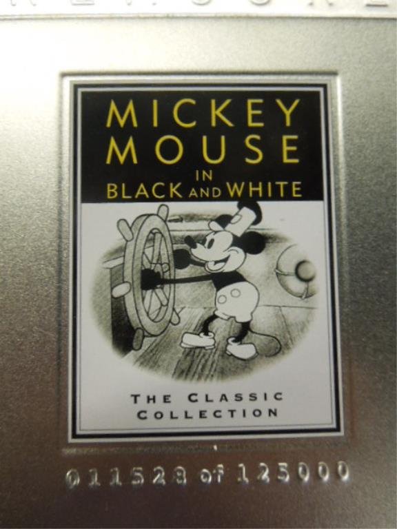 4 Disney Treasures DVD Sets: Four Disney Treasures DVD sets, including: Mickey Mouse in B & W, Silly Symphonies, Mickey Mouse in Living Color & the Complete Goofy, sets in official CD cases in tin containers.