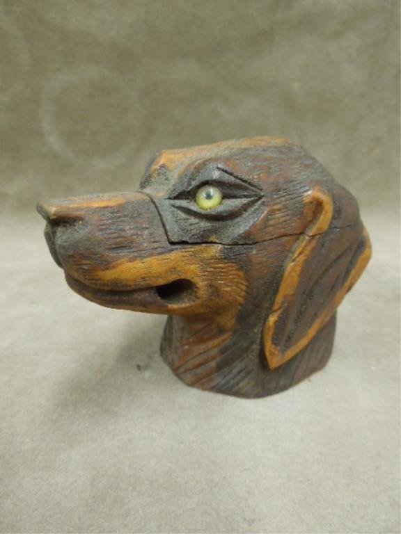 Wood Carved Dog Inkwell: Wood carved dog inkwell, "Pointer", with glass eyes, opening in mouth (at sides) for pen holder, hinged lid over glass insert, early 20th c. 3 3/4" x 2" x 2 3/4". CONDITION: Minor wear & minor loss at