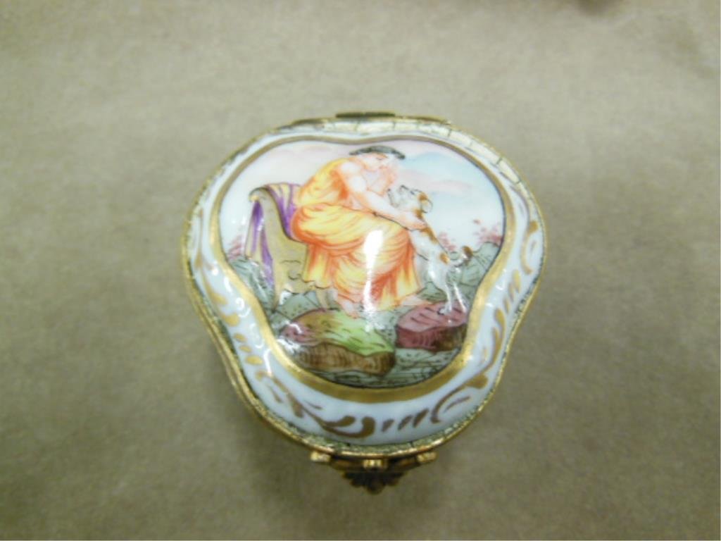 Capo di Monte Porcelain Pill Box: Capodimonte porcelain pill box, painted woman with dog on lid & Putti around base, 2 1/4" x 2 1/4" x 1 1/4" height. CONDITION: very minor wear from age.