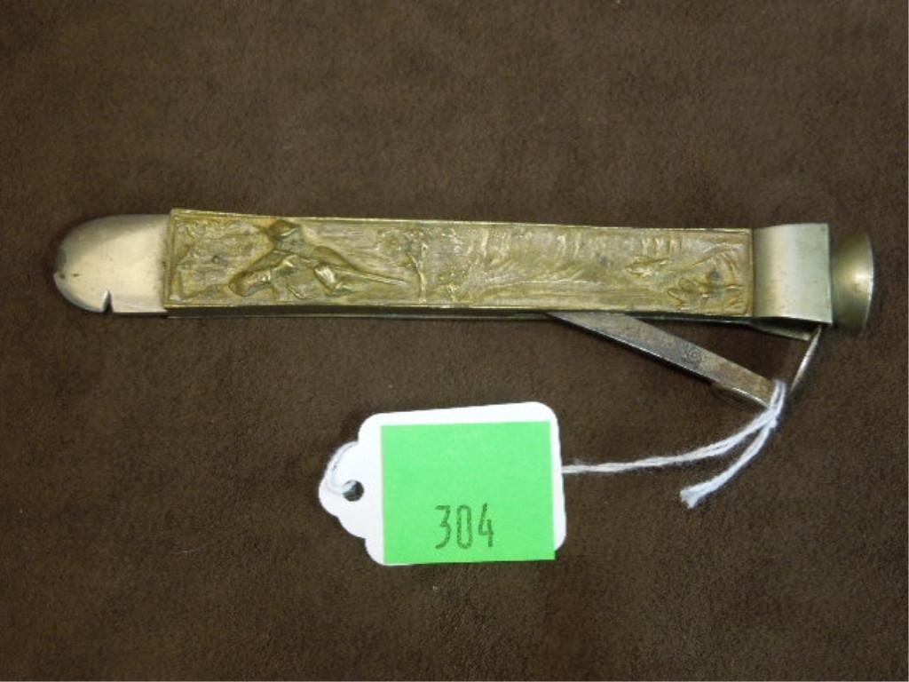 Victorian Cigar Cutter: Victorian Cigar cutter, with bronze embossed duck hunting & marsh scenes, makers touch mark on cutter, early 20th C., length 6". CONDITION: Some wear from age.