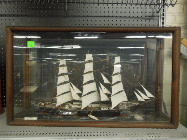 "Cutty Shark-London" Ship Model: "Cutty Shark-London" ship model, polychromed wood in fitted mahogany & glass case, early 20th C., case 30 1/2" x 18" x 9". CONDITION: Two rowboats came unglued & have fallen out of boat onto faux wate