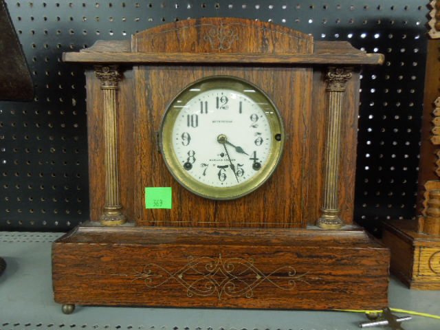 Seth Thomas Mantel Clock: Seth Thomas mantel clock, rosewood? veneered wood case with incised lines & brass finished columns, porcelain dial with Sonora chiming movement, early 20th C. length 35", height 13 1/2". CONDITION: Ve