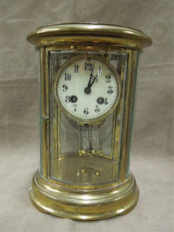 French Crystal Regulator Clock: French crystal regulator clock, brass with glass beveled curved panels, porcelain dial, 1390, 4.6 on back of works, time & strike with key faux mercury pendulum, early 20th C. CONDITION: Some wear, es