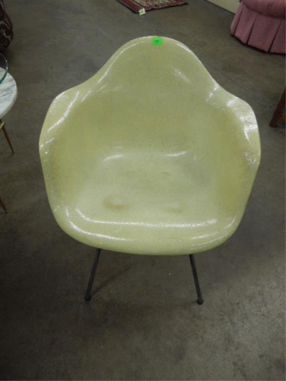 Herman Miller, Charles Eames Design Chair: Herman Miller, Charles Eames design chair in pale yellow molded plastic, steel legs, original label on bottom, mid 20th C., height 29 1/2". CONDITION: Normal wear.