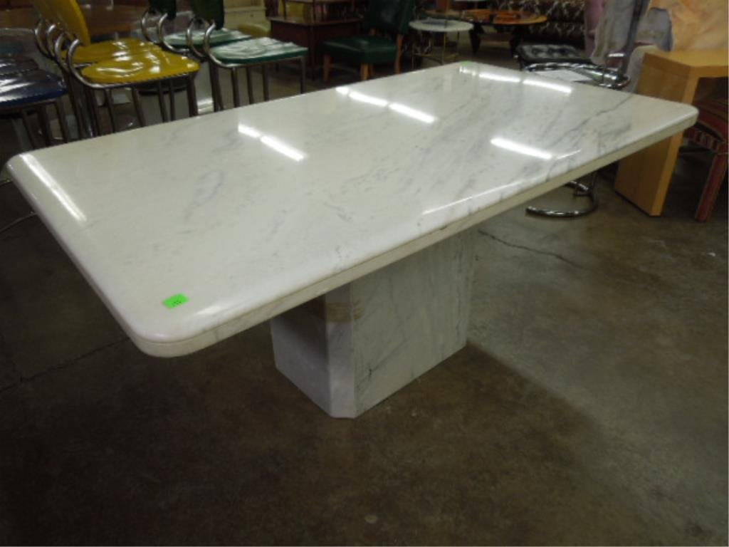 Marble Dining Room Table: Marble dining room table, white marble with rounded edges on a cut corner block base, late 20th c. 39” x 70” x 30”. CONDITION: Normal wear.