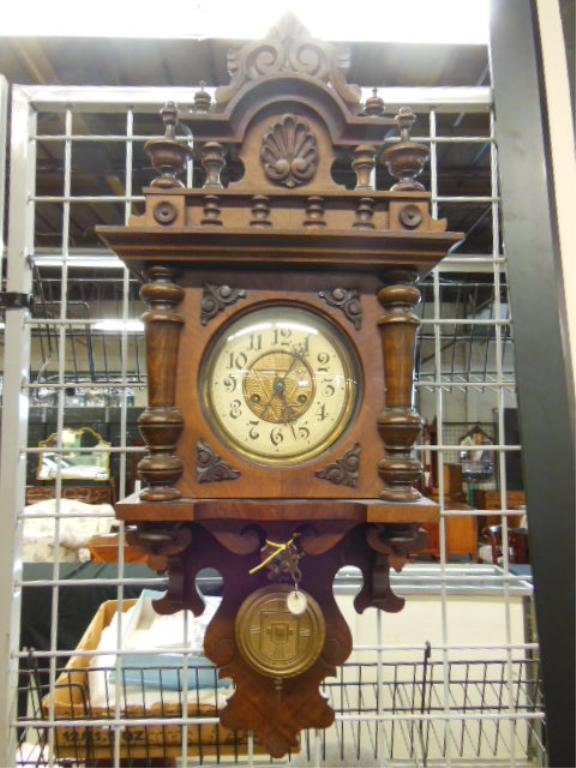 German Wall Clock, Renaissance: German, wall clock, Renaissance Revival style, walnut, with ring, urn & shell carvings, time & strike movement, late 19th C., 15 1/2" x 34" x 9". [11] CONDITION: Repairs to base apron, currently runni