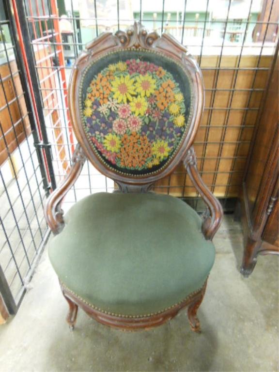 Rococo Revival Lady's Chair: Victorian Rococo Revival lady's chair, walnut carved cameo back with a needlepoint upholstered seat, half arms, late 19th C. H 40". Condition : small tear at top of back.