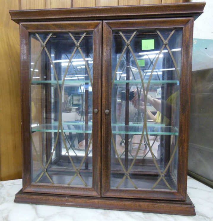 Wall Mirror Curio Cabinet: Wall mount curio cabinet, mahogany with 2 glass & brass fretwork doors, mirror back, mid 20th c. 21 1/2" x 20" x 7 1/4". CONDITION: No issues noted.