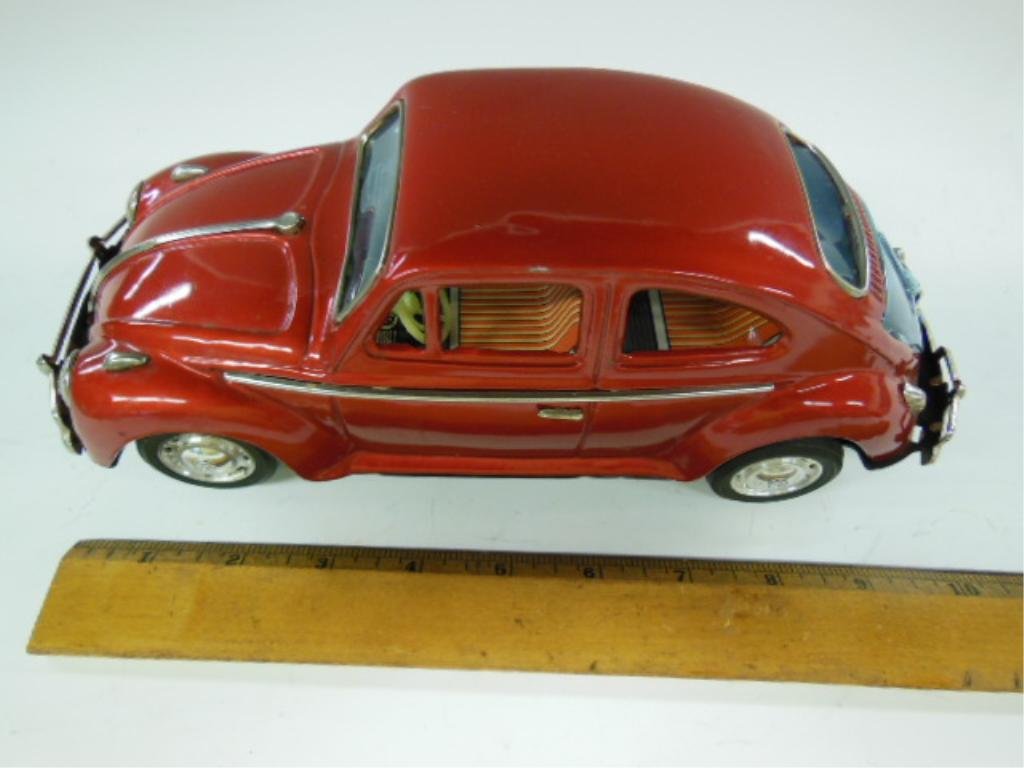 Japanese Tin Volkswagen Beetle Bump N Go Car: Japanese tin Volkswagen Beetle bump n go car. CONDITION: Good, used. Not tested. Rear window pushed in slightly.