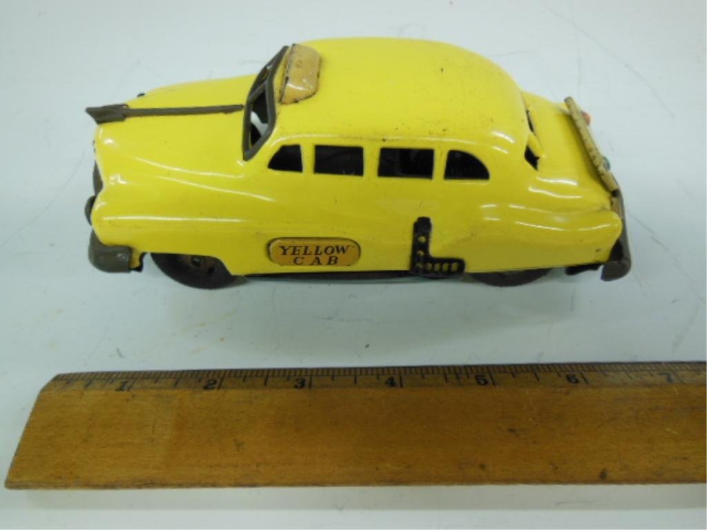 Vintage Tin Friction Taxi, Japan: Vintage tin friction taxi, made in Japan. CONDITION: Shows some wear, works, missing a hub cap.