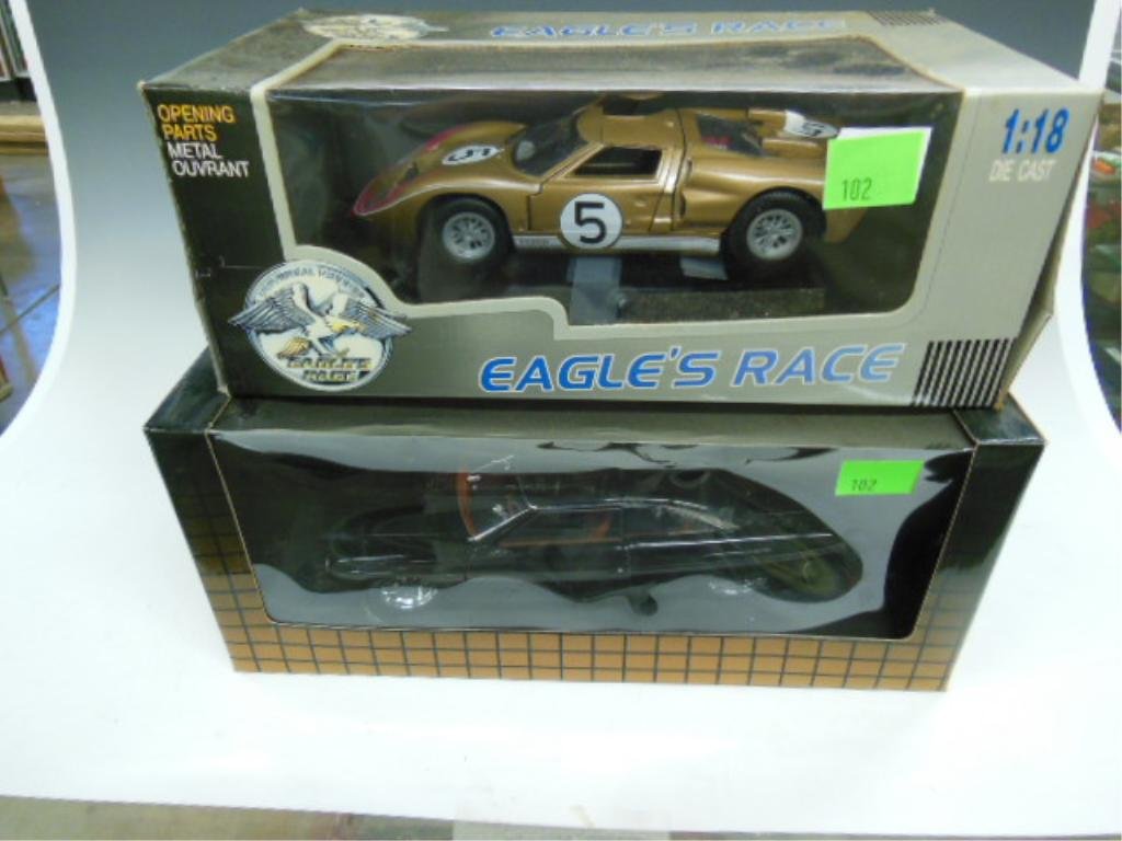 Die Cast Cars by Auto Art: Two die cast collector cars: one Ford GT-40 by Eagles Race, one 49' Ford street rod by Auto Art. CONDITION: New in boxes.