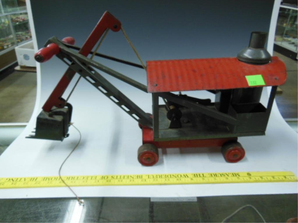 Pressed Steel Child's ride-On Digger Truck: Vintage pressed steel child's ride-on digger truck with handle, 20" l x 11.5" t x 7.5" w. CONDITION: Good for age, some paint loss, broken string.