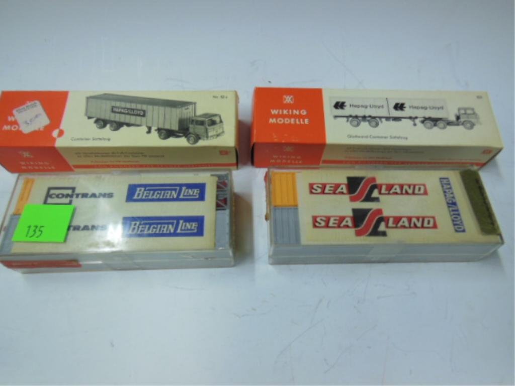 HO Train Set Accessories: H.O. train set accessories: two Hapag-Lloyd trucks & two Rowa shipping container sets. CONDITION: Good in boxes.