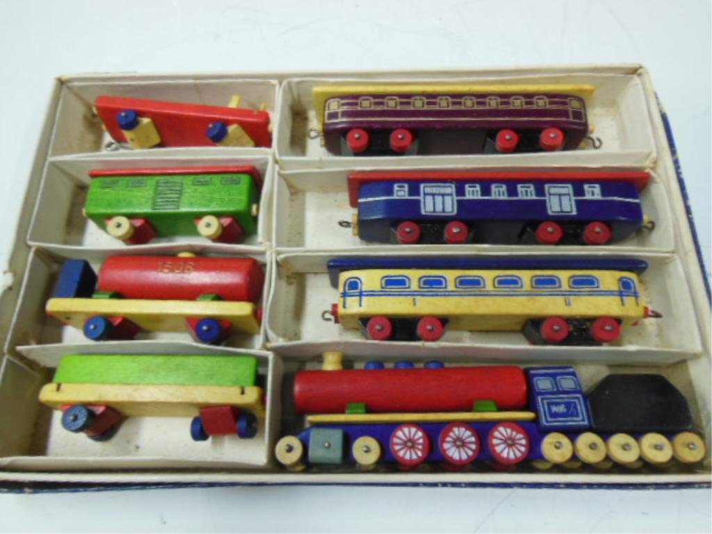 Children's Wooden Toy Train Set by Toia: Children's wooden toy train set by Toia. CONDITION: Good, used with original box. Some wear.