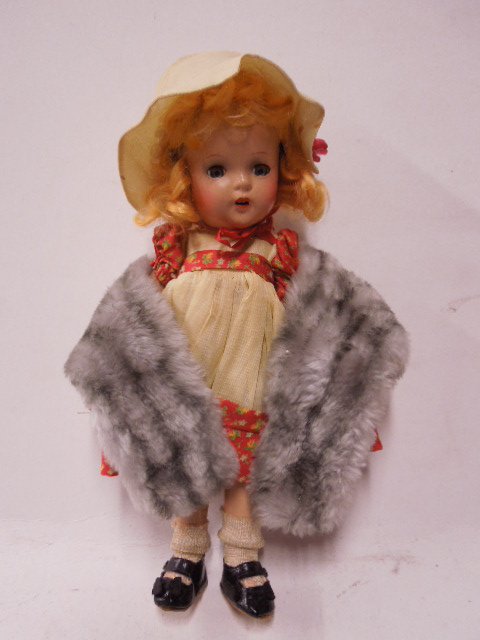 Madame Alexander Bisque Doll: Vintage Madame Alexander "Kate Greenaway" bisque doll. 13" tall with sleepy eyes. CONDITION: Fair, cracking though-out.