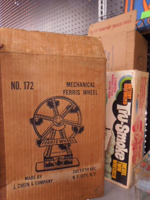 3 Vintage Toy Boxes (empty): 3 vintage toy boxes (empty), mechanical ferris wheel, Remco Tru-smoke truck and Live Action #700 transport trailer truck Condition; fair, some tears