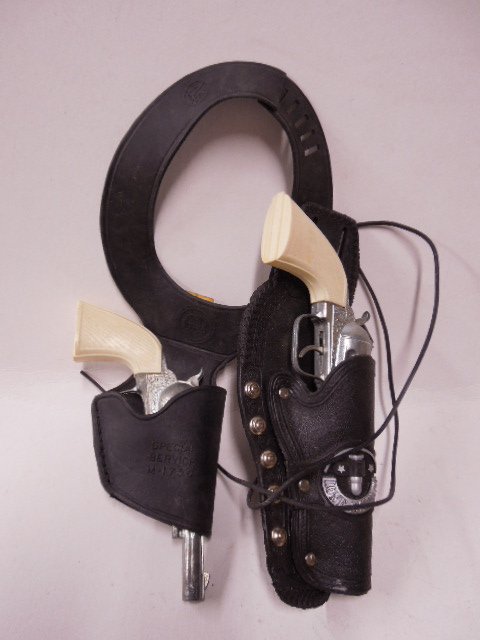 Pr Lone Ranger Cap Guns & Holsters by Marx: Pair of Lone Ranger cap guns & holsters by Marx. CONDITION: Fair, shows wear from use.