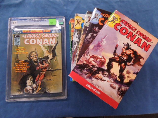 Savage Sword of Conan Annual #1: Savage Sword of Conan annual #1, circa 1975. Graded an 8.5 by C.G.C. Universal. along with Savage Sword of Conan 5-vol. book set by Dark Horse. Soft cover.CONDITION: Good.