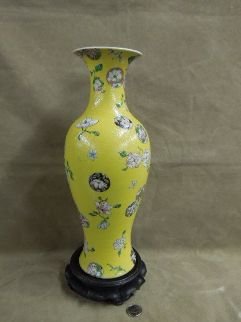 Chinese Yellow Ground Vase: Chinese yellow ground vase; with textured floral & medallion field, Robbins egg blue interior; signed late 19th c. hgt 13 7/8". CONDITION: No issues noted.